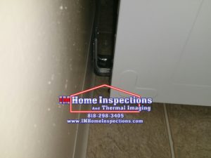 A visible anti-tip bracket correctly installed.